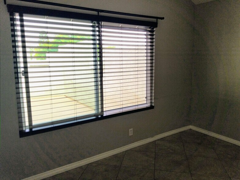 Brand new living room blinds. - 18681 Maplewood Cir