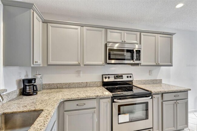 Building Photo - 5710 Princess Palm Ct