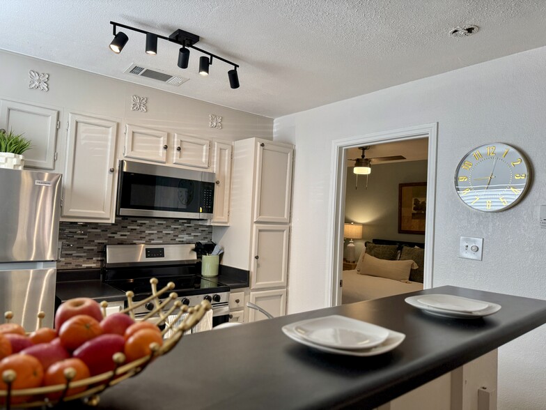 High bartop facing kitchen and view to bedroom - 4107 Medical Dr