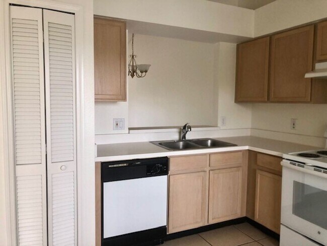 Building Photo - Nice 2X2 located on 2nd floor- Tile & lami...