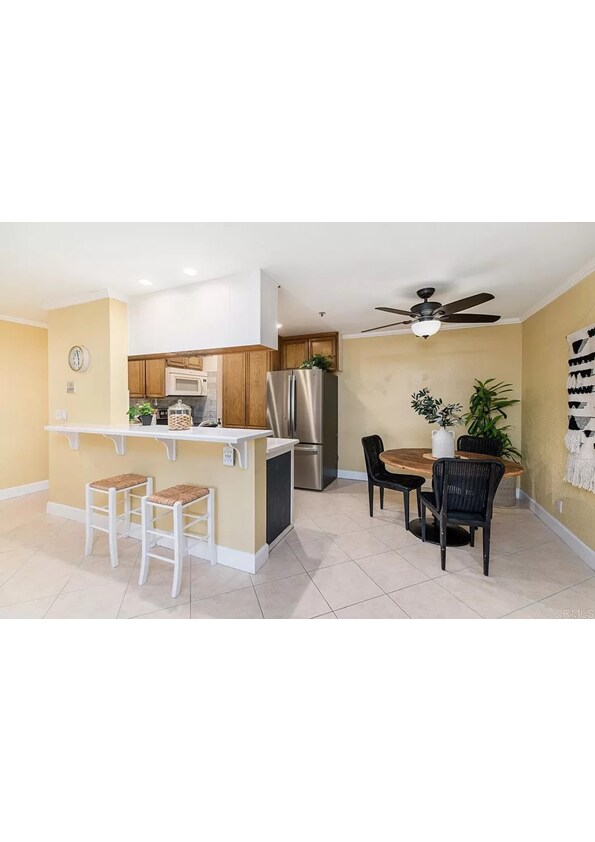 Kitchen is fully furnished with appliances. The furniture shown is not there. - 5705 Friars Rd