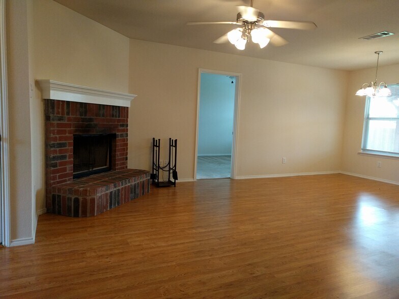 LIVING ROOM WITH FIREPLACE AND CEILING FAN - 510 Oxford Loop