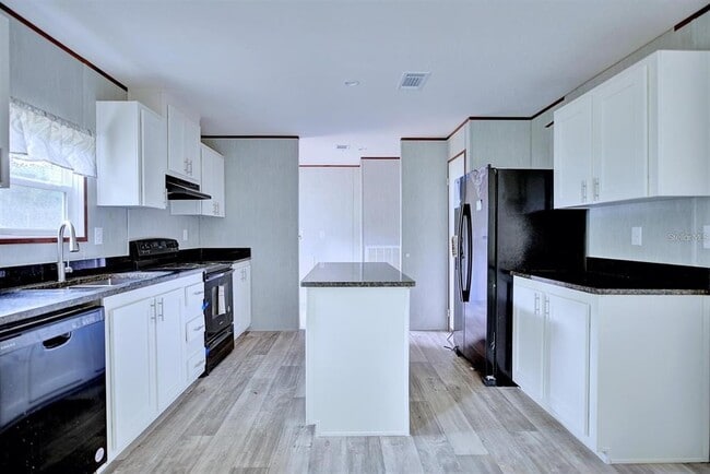 Building Photo - 8595 NW 13th Ct