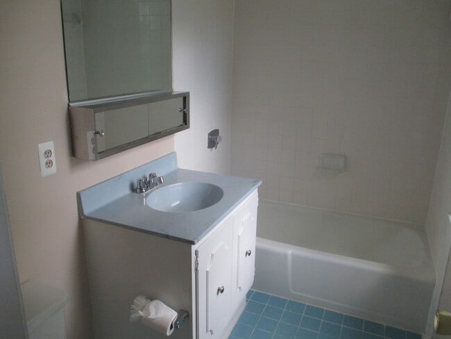 Building Photo - SPACIOUS BRICK TOWN-HOME