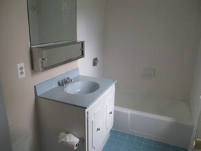 Building Photo - SPACIOUS BRICK TOWN-HOME
