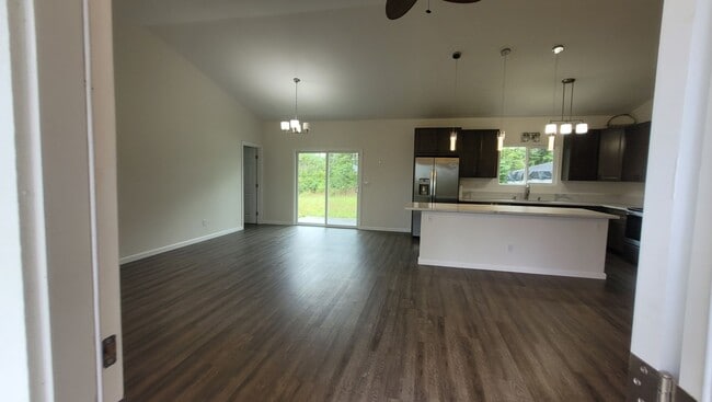 Building Photo - This 3-bedroom, 2-bath home in Orchidland Subdivision