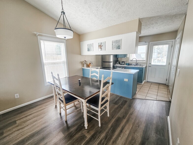 Dining room table seats 6, or with leaf installed upon request, up to 8! - 2127 Winter Moss Ln