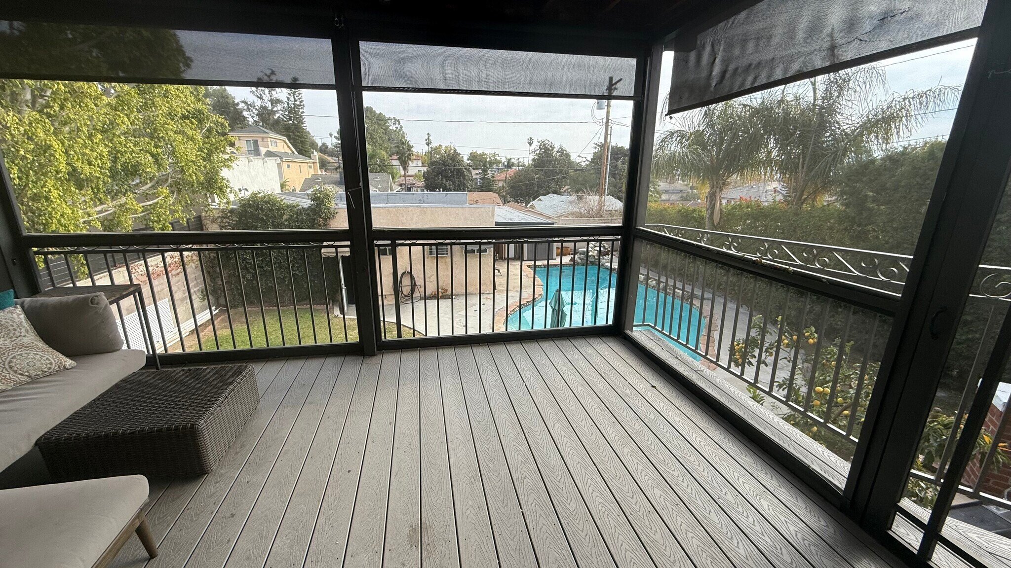 Screened in Patio off of Kitchen looking onto backyard pool area - 1068 E San Jose Ave