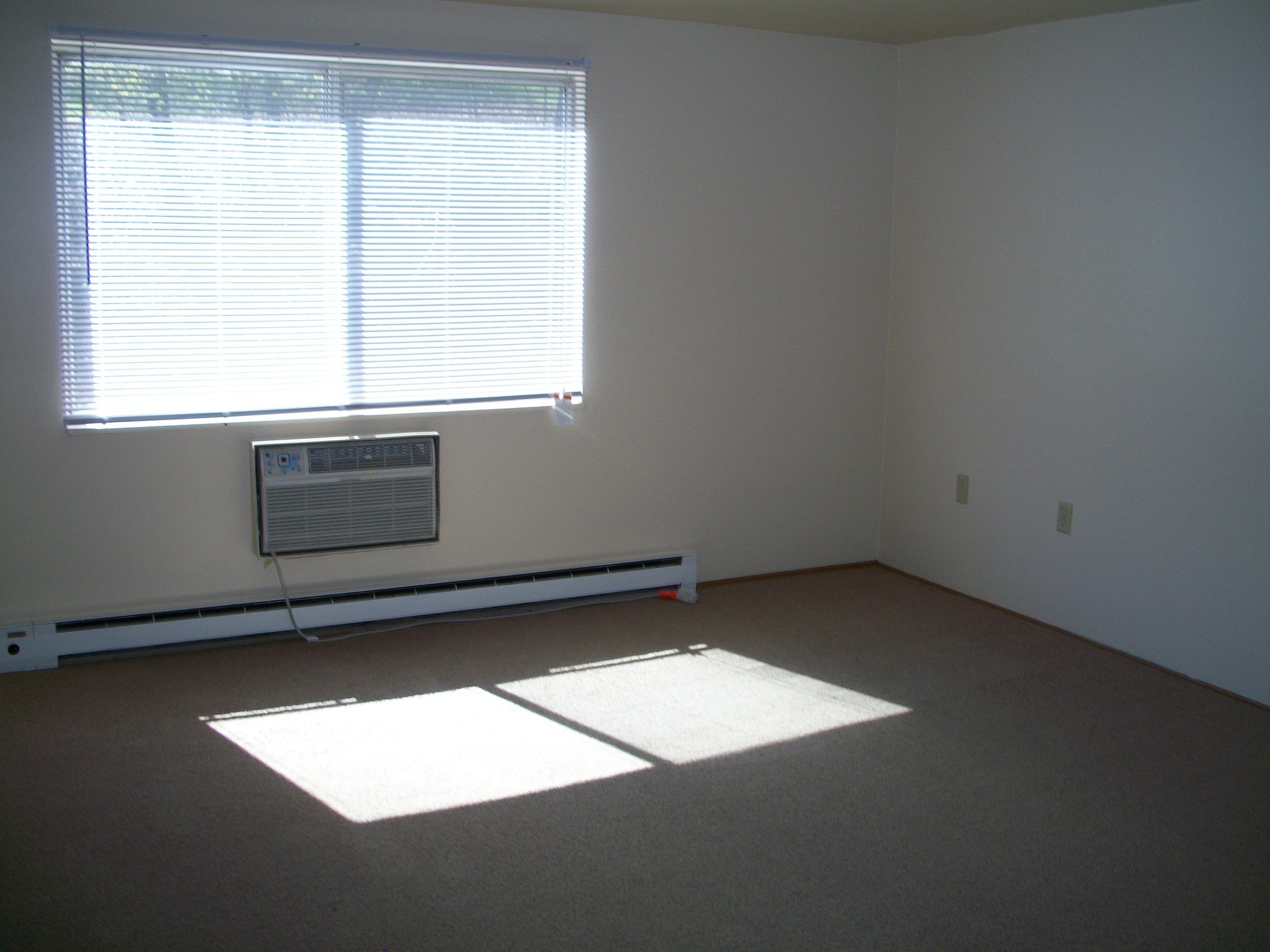 Large master bedroom has new laminate flooring. AC unit included. Window blinds included. - 502 Mercer Rd