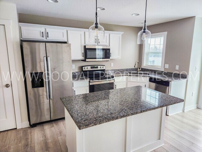 Building Photo - Summer rent special: $250 off the first two months rent! Modern Ankeny Townhome with Two Primary ...