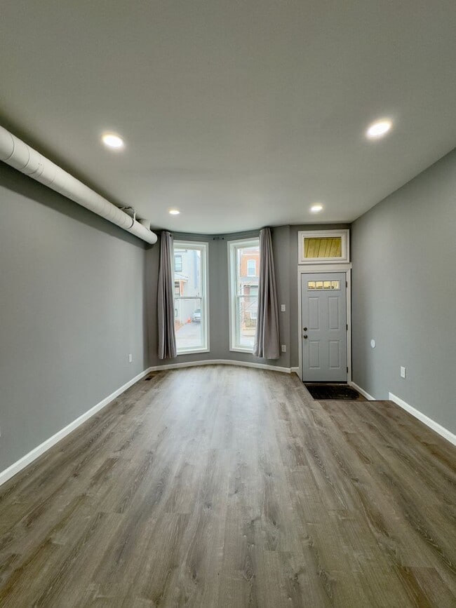 Building Photo - Spacious 4-Bedroom Townhome with Modern Amenities in Baltimore!