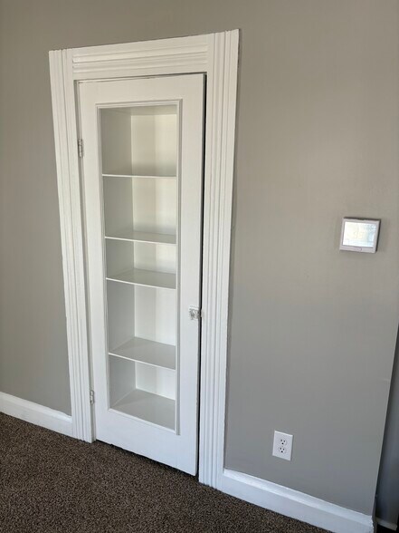 Bookshelf closet door in living room - 1394 Wayne St