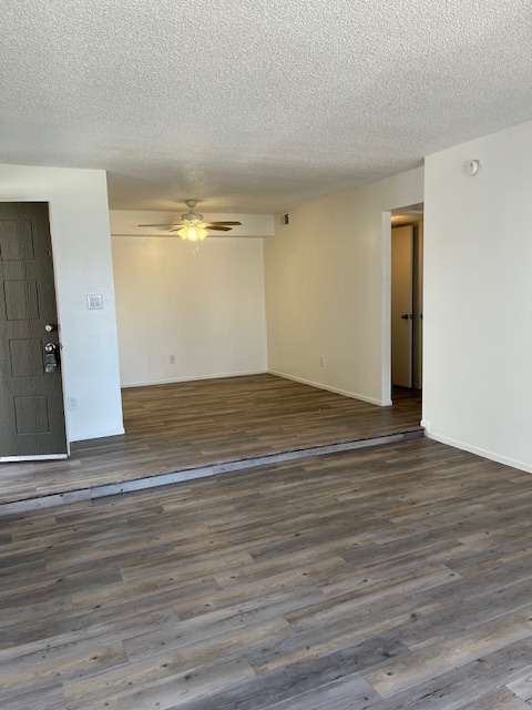 Empty living room/dining area (popcorn ceilings have been removed) - 6480 N 82nd St