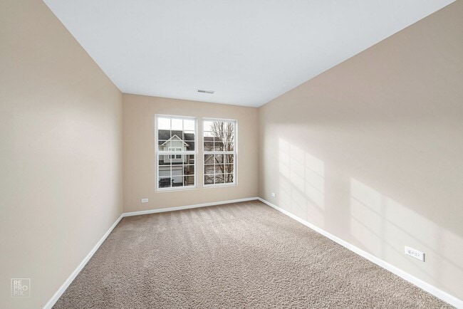 Building Photo - AUTUMN CREEK SECOND FLOOR CONDO WITH TWO CAR GARAGE