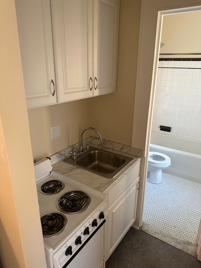Building Photo - Studio Available All Utilities Included