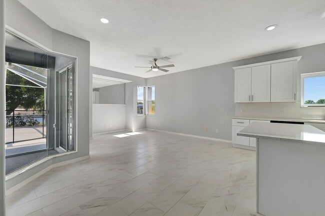 Building Photo - A BOATER'S PARADISE WITH THIS STUNNING 3 BEDROOM, 2 BATH WATERFRONT POOL HOME W/DOCK & BOAT LIFT ...