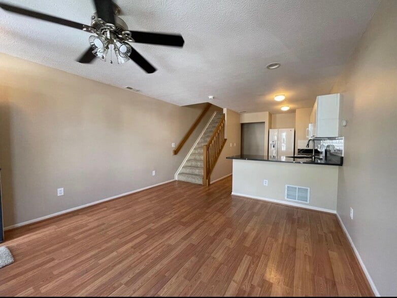 Spacious living area with open concept layout connecting kitchen and living room. - 289 Preswicke Ml