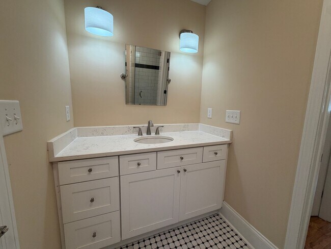 Building Photo - Freshly Painted Split-Level Home with Large Deck & Lawn Care Included