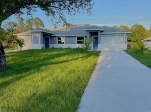 Building Photo - 3/2/1 - GREAT LOCATION IN LEHIGH ACRES- BELL BLVD