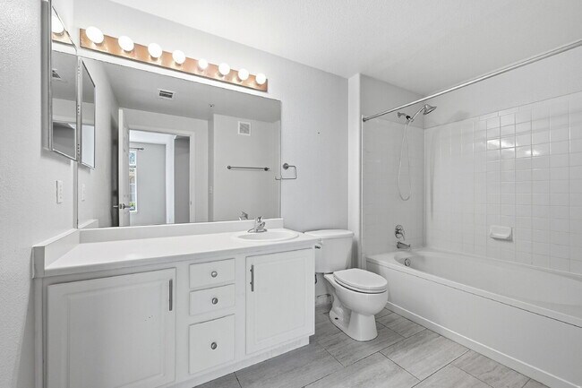 Building Photo - $1,745.95 - Ground-Level 1 Bed + Flex Room | 1.5 Bath Condo with Community Pool