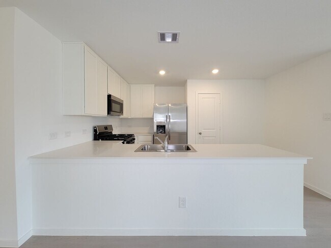 Building Photo - This great new single-story design makes smart use of the space available. At the front are all t...