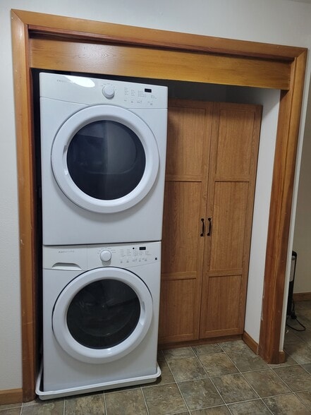 Home includes stack washer/dryer and storage cabinet - 13344 23rd Pl NE