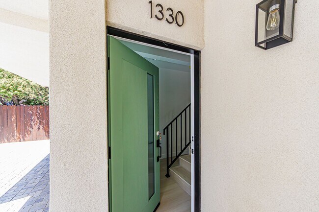 Building Photo - Modern 4-Bedroom Townhome-Style Living in ...