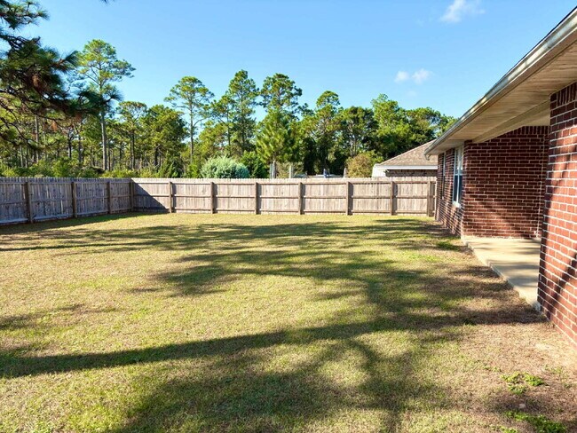 Building Photo - "Charming 4-Bed home in Navarre!"
