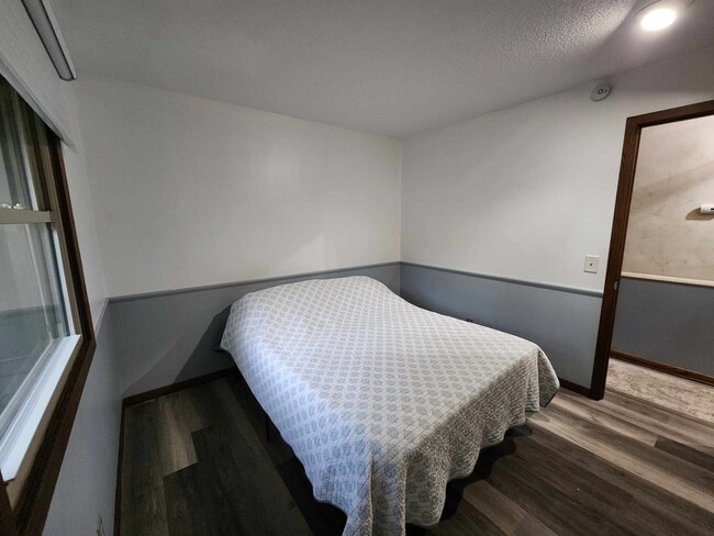 Smaller bedroom will fit a king with approx. 1 1/2 to 2 ft. on each side - 4449 Unity Ave N