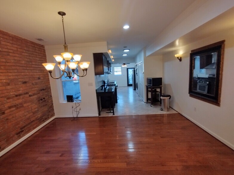 Primary Bedroom Expansive primary bedroom featuring five large windows that flood the space with na - 1933 4th St NW