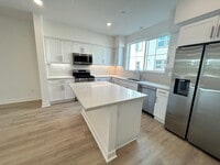 Building Photo - Gorgeous, 3 level townhome, featuring 2 car garage central Air, and in Unit laundry.