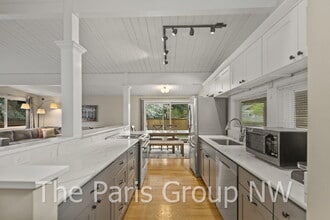 Building Photo - Fantastic Modernized Bridle Trails Mid Century Home * Central A/C, EV Charger, Exceptional Outdoo...