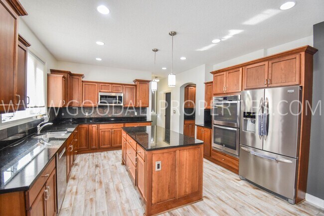 Building Photo - 4 Bedroom 4 Bath Executive Home in West Des Moines with a fenced in yard and a 3-car garage