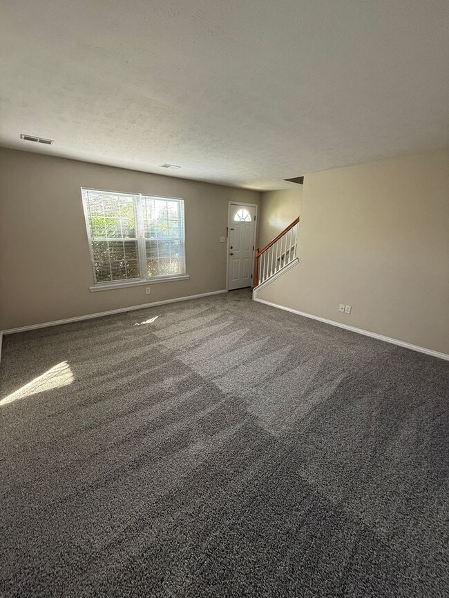 Building Photo - 2-bedroom, 1.5-bath townhouse with an attached garage