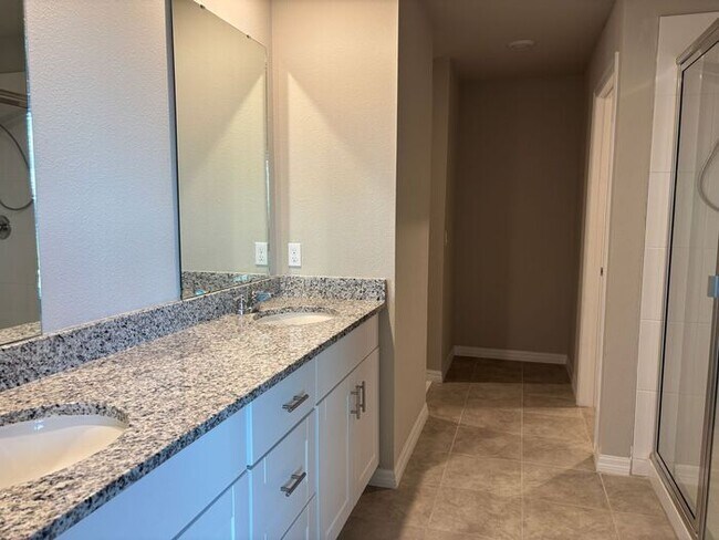 Building Photo - Like-New 4 Bedroom 3 Bath with Pond View & Two Living Spaces — Minutes to South Lake Nona