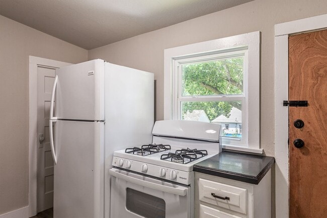 Building Photo - Remodeled 2-Bedroom Bungalow with Detached Garage & Large Backyard