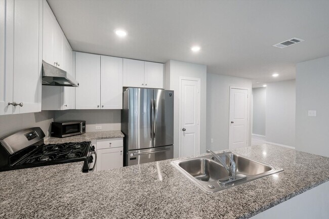 Building Photo - Open-Concept Living with New Flooring