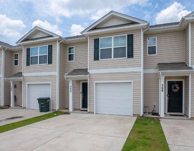 Building Photo - Partially furnished and now available!