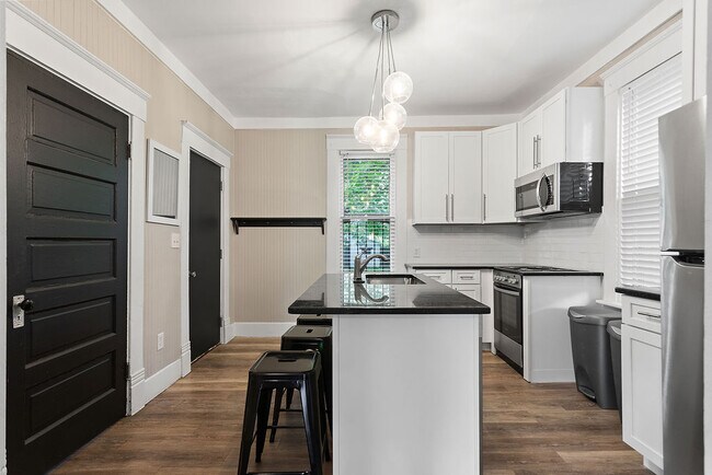 First door is 1/2 bath and laundry - 1287 Mooberry St