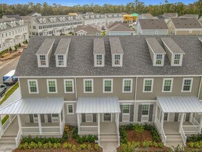 Building Photo - New Luxury Townhome in Celebration, FL Corner unit. All porcelain tiled floors. Aleutian model by...