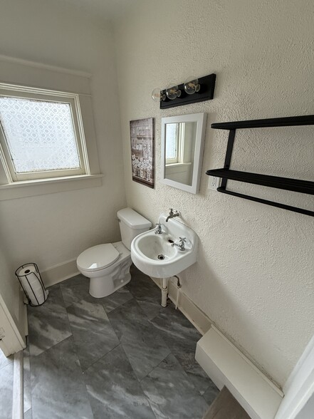 New floors in shared bathroom - 428 S Main St
