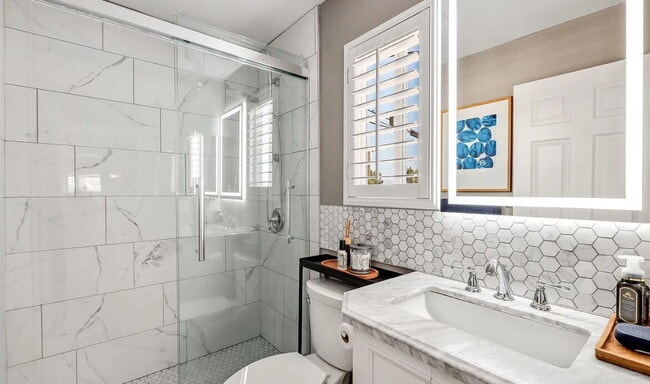 Building Photo - This quaint, gated complex is located on a...