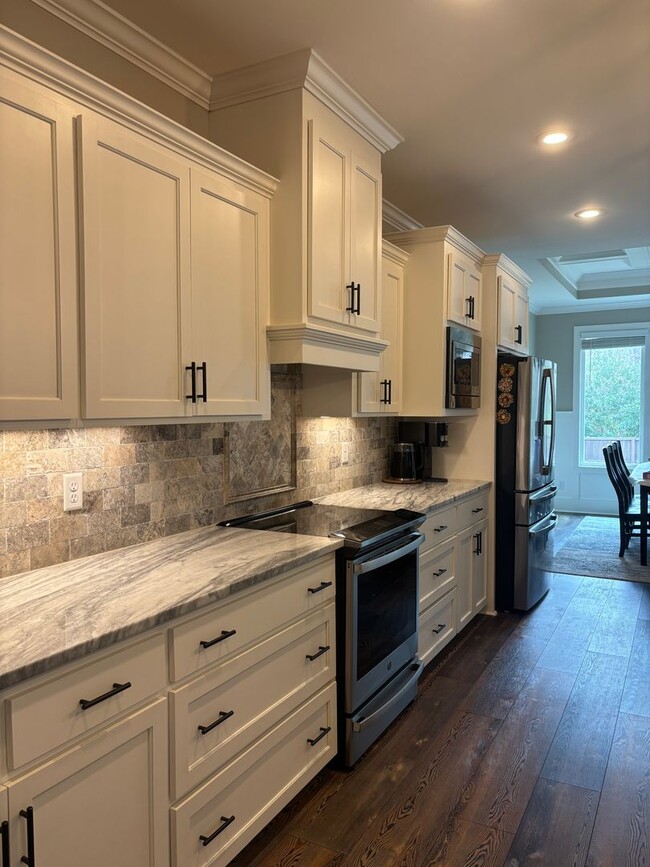 Building Photo - Spacious 4BR/3BA Creekside West Home with Screened Porch, Fenced Yard & 3-Car Garage