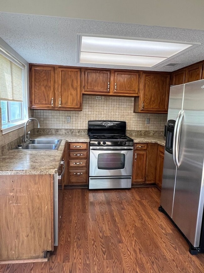 Building Photo - Corner Lot with Large Deck and Cozy Backyard