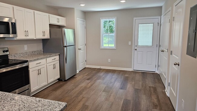 Building Photo - Built in 2024! Close to downtown 2 Bed/2.5 Bath. Nice private backyard with trees