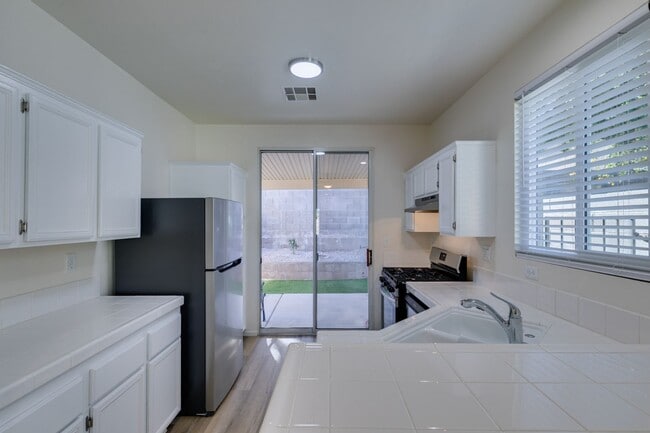 Building Photo - SUMMERLIN BEAUTY*UPGRADED*COMMUNITY POOL*3 BEDROOMS*STAINLESS STEEL APPLIANCES*