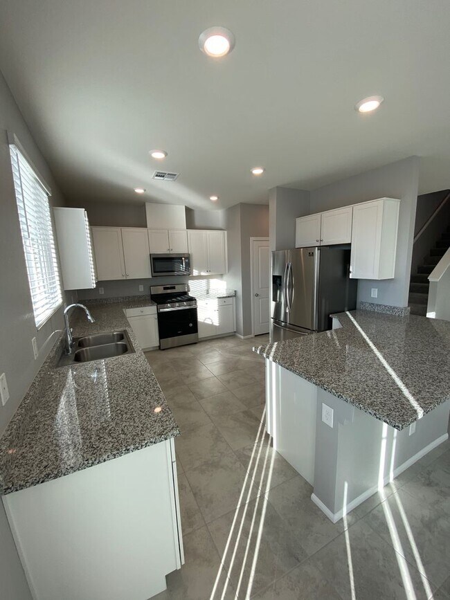 Building Photo - Modern North Las Vegas Townhome with Granite Countertops, Covered Patio & Open-Concept Living