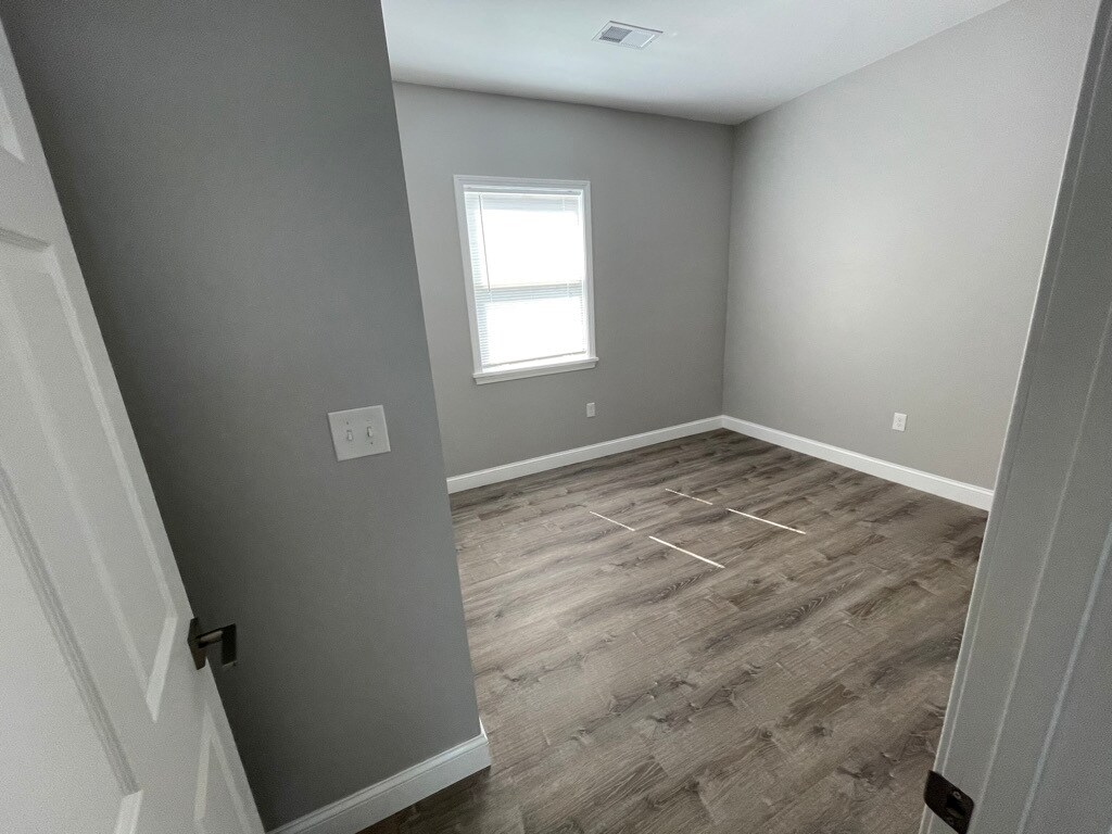 Unit two: bedroom one with closet. - 34 Falcon St