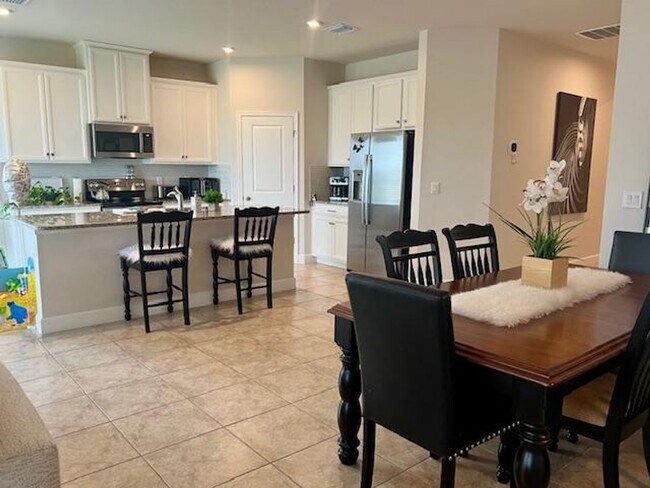Building Photo - Open concept home offering four bedrooms, three baths, a two car garage and open lanai.