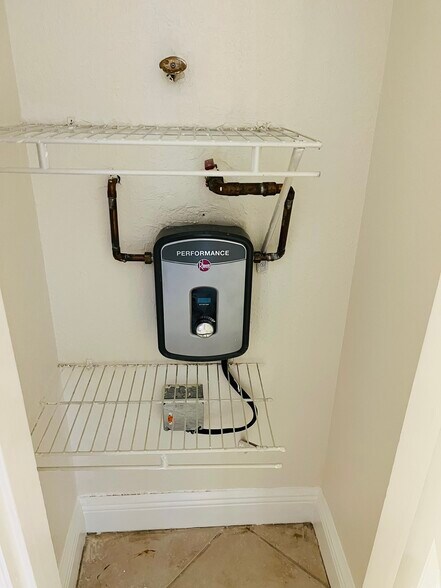 Brand new tankless water heater. To give you more space in the linen closet. - 8601 SW 94th St